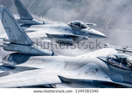 Fighter Jets in sky Royalty-Free Stock Photo #1349383340