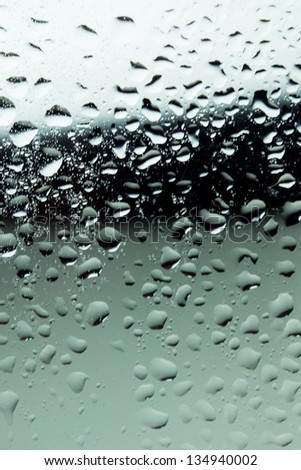 close up of water drops on glass surface