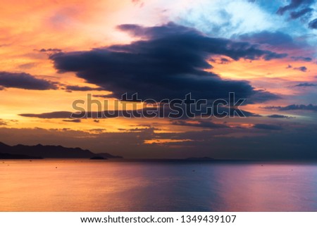 dramatic sky at sunset on the beach