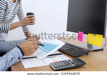 businessman work with friend on the table with computer laptop calulator ,working data analyses for business plan and marketing.