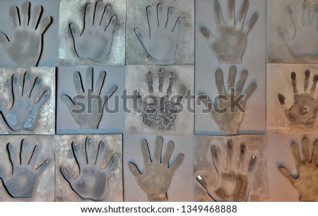 The image of the palm pressed into the tin plate.