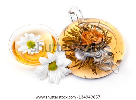 	green tea with cookies and flowers on a white background