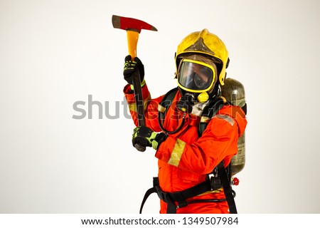 Firefighter with fire fighting equipment and accessories on white background