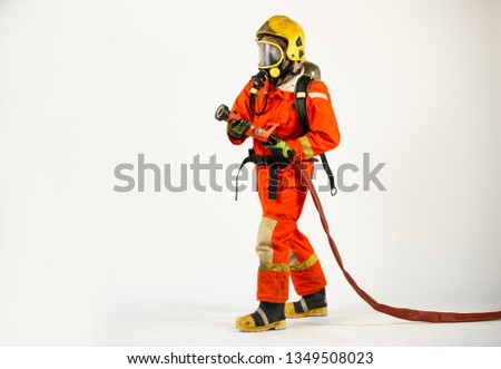 Firefighter with fire fighting equipment and accessories on white background