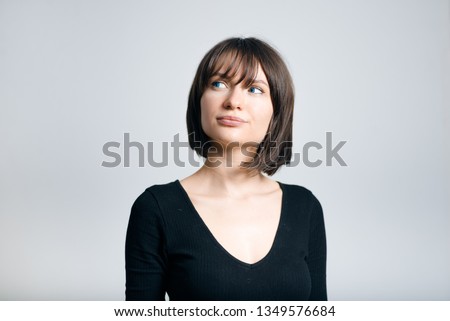 beautiful business woman has a good idea isolated on gray background