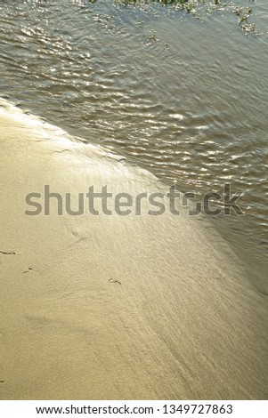 Clear and pure river water flowing with ripples- nature abstract photograph  
