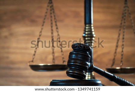 Law and Justice concept on wooden background