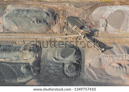 Industrial place from above. Mine storage place, mining minerals and black coal. Picture made by drone.
