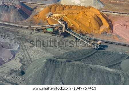 Industrial place from above. Mine storage place, mining minerals and black coal. Picture made by drone.