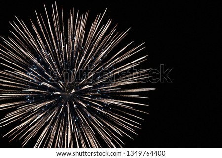 Close-up photo of fireworks exploding in the night sky