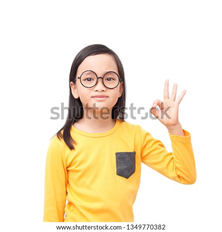 Asian girl wear glasses showing ok sign  background