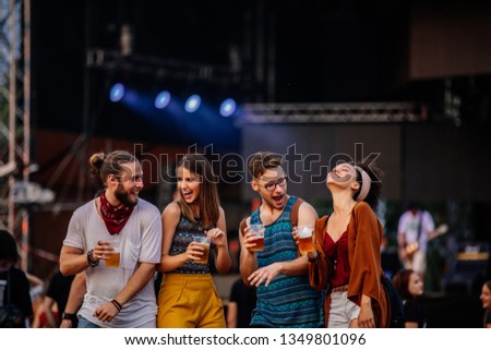 Cropped shot of four friends having a great time at a music festival Royalty-Free Stock Photo #1349801096