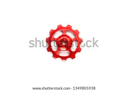Red roller, gear for bicycle rear derailleur isolated on white background
