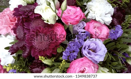 Spring bouquet of mixed colorful flowers. Flowers bouquet including chrysanthemum, lisianthus, pink roses, white roses, pink carnation dianthus . Beautiful bright flowers background.