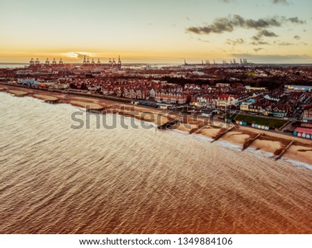 Aerial view of the Port of Felixstowe with cranes and sea side Royalty-Free Stock Photo #1349884106