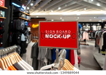 Mock up horizontal blank signboard with clipping path to show promotion or price at fashion clothes shop, Red screen in acrylic frame, empty space for insert text or advertising