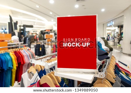 Mock up horizontal blank signboard in acrylic frame with clipping path to show promotion or price at fashion clothes shop, Red screen empty space for insert text or advertising
