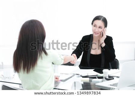 handshake Manager and client.women's power in business.photo with copy space