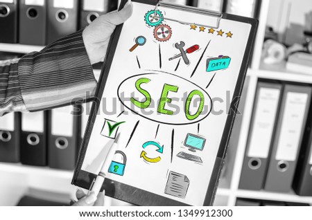 Woman holding a clipboard with seo concept