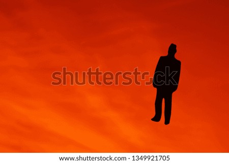 black figure of Business Man on Blue Sky background. 