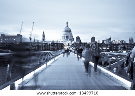 Blurred people on the Millennium bridge, London.