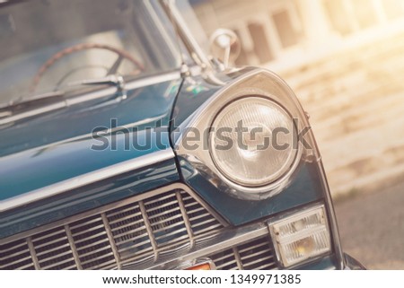 Detail of a vintage car. Close up of headlight retro classic car. Vintage effect style pictures. Classic car.