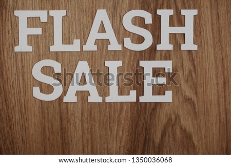 Flash Sale alphabet letters on wooden background business concept