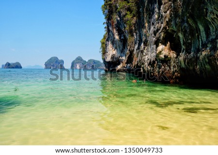 A girl is diving on the sea with the fisherman,Krabi,Thailand