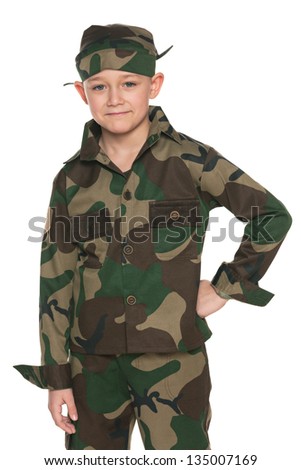 A portrait of a boy dressed in camouflage; on the white background