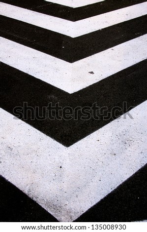 Street arrows on the road as sign