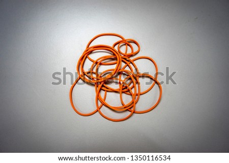 A stack of rubber band on white isolated background, with vignetting effect