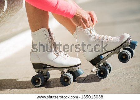 Close-up Of Legs Wearing Roller Skating Shoe, Outdoors
