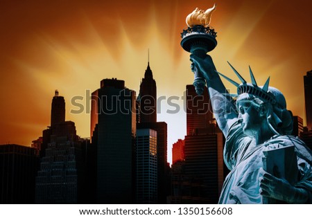 Symbols of New York City. Manhattan Skyline and The Statue of Liberty at sunset