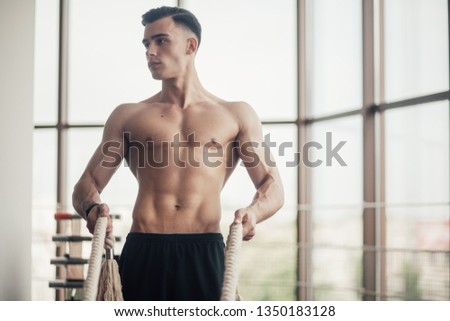 sports man in the gym, perfect body