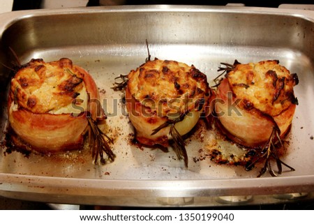 stuffed onion with bacon on metalplate , Jamie Oliver recipe