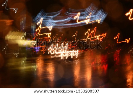 Urban street lights abstracted, captured in movement at slow shutter speed 