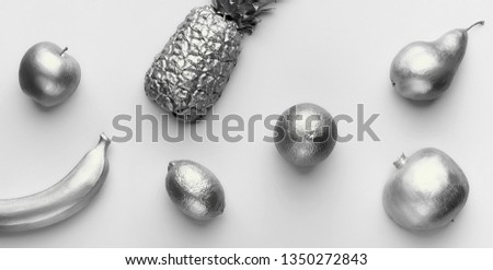 Collage of silver fruits on white background