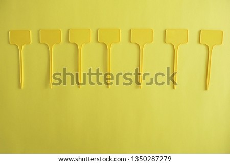 Empty Yellow Labels on Yellow Background
