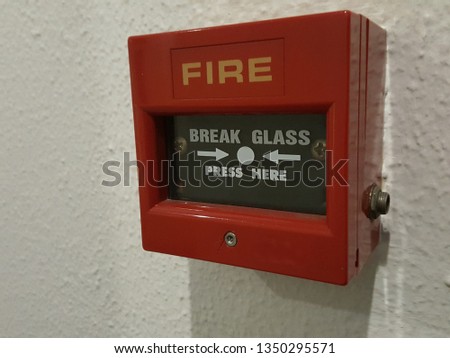 Red fire alarm in the building.