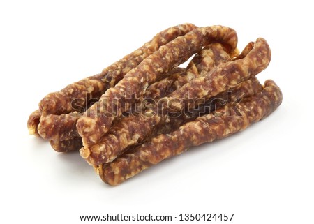 Dried thin pork sausages, smoked meat, close-up, isolated on white background.