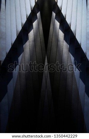 Metal grid, lath or louvered structure of girders. Abstract construction and architecture photo with polygonal pattern and parallel lines. Closeup of industrial building exterior or interior framework