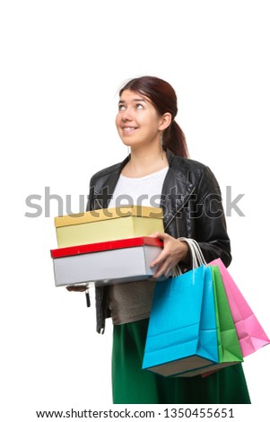 Happy young woman with shopping bags and boxes