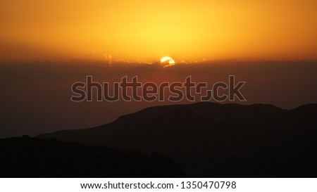 Sunset over the mountains in Petra, Jordan.