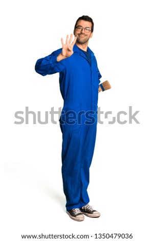 A full-length shot of a Painter man happy and counting four with fingers on isolated white background