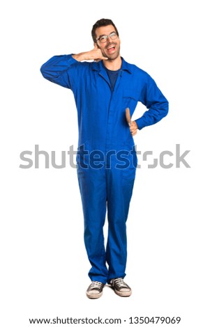 A full-length shot of a Painter man making phone gesture. Call me back sign on isolated white background