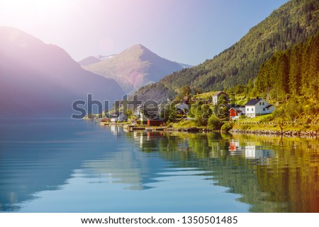 Amazing nature view with fjord and mountain. Beautiful reflection. Location: Scandinavian Mountains, Norway. Artistic picture. Beauty world