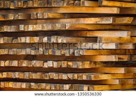 Wooden planks. Beams. Air-drying timber stack. Wood air drying (seasoning lumber or wood seasoning). Timber. Lumber. Close-up. Texture
