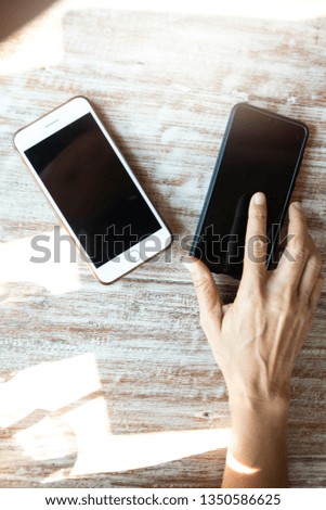 smartphones on brown wooden background,  top view 