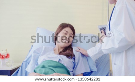 Young Asian doctor woman talking and holding hand for women patient in sick bed. Medicine, age, healthcare, psychiatrist and people concept.