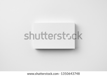 Design concept - top view of horizontal business card isolated on white background for mockup, it's real photo, not 3D render